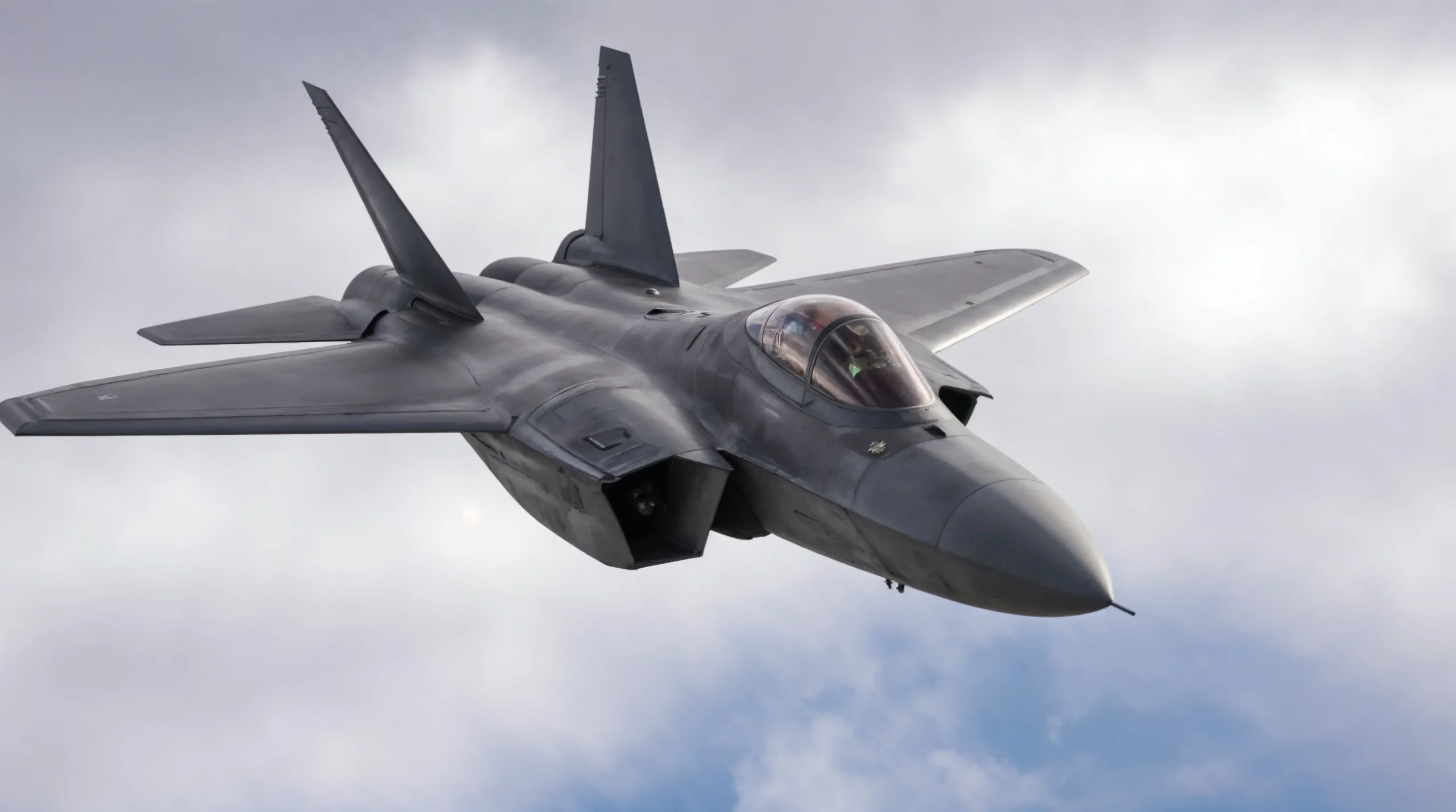 Home 57 Fighter jet in flight above clouds representing aerospace and defense asset tracking with RTLS