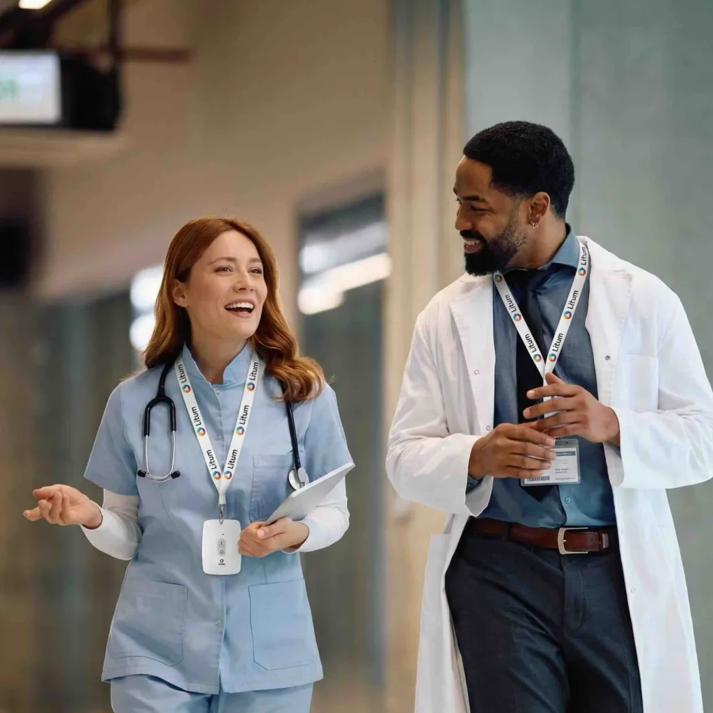 RTLS in Healthcare: Real-World Case Studies in Patient Safety, Staff Protection, and Asset Management 12 Alt text: Nurse and doctor walking in hospital corridor wearing Litum RTLS staff tags
