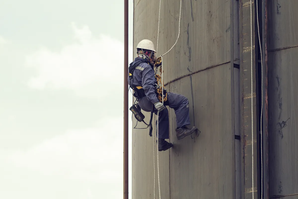 Home 78 Industrial lone worker wearing safety equipment in a high-risk facility representing the need for real-time UWB RTLS tracking and lone worker safety monitoring systems