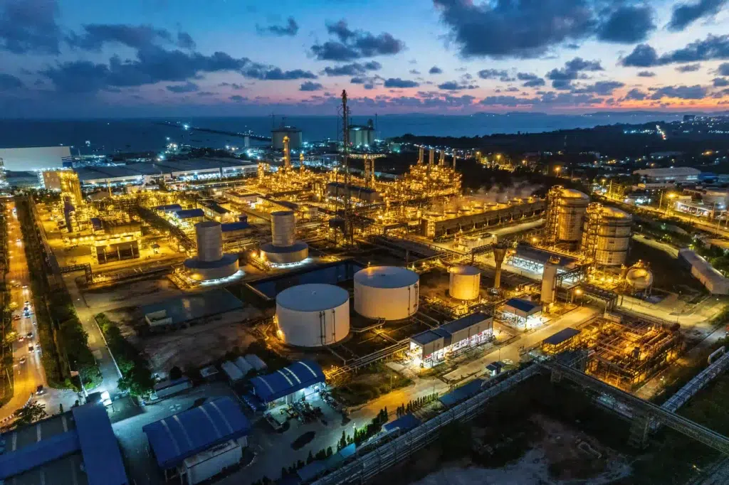 How Real-Time Location Systems (RTLS) Improve Safety in Hazardous Industrial Areas 2 RTLS in hazardous areas — aerial view of petrochemical plant at twilight showing ATEX-classified refinery zones