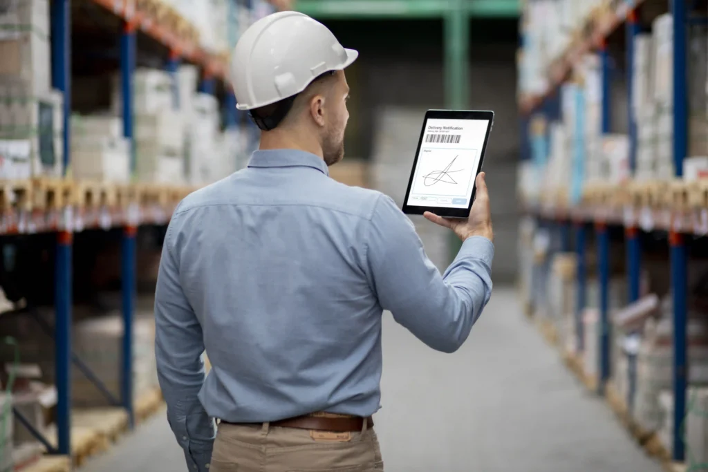 OSHA Forklift Certification in 2026: What the New Behavioral Monitoring Requirement Means for Your Operation 3 Warehouse supervisor reviewing forklift tracking system data on tablet