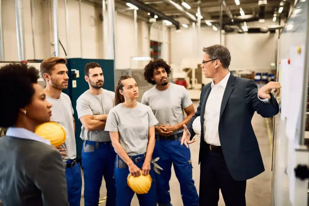 OSHA Forklift Certification in 2026: What the New Behavioral Monitoring Requirement Means for Your Operation 2 Safety manager conducting forklift certification training session with warehouse team
