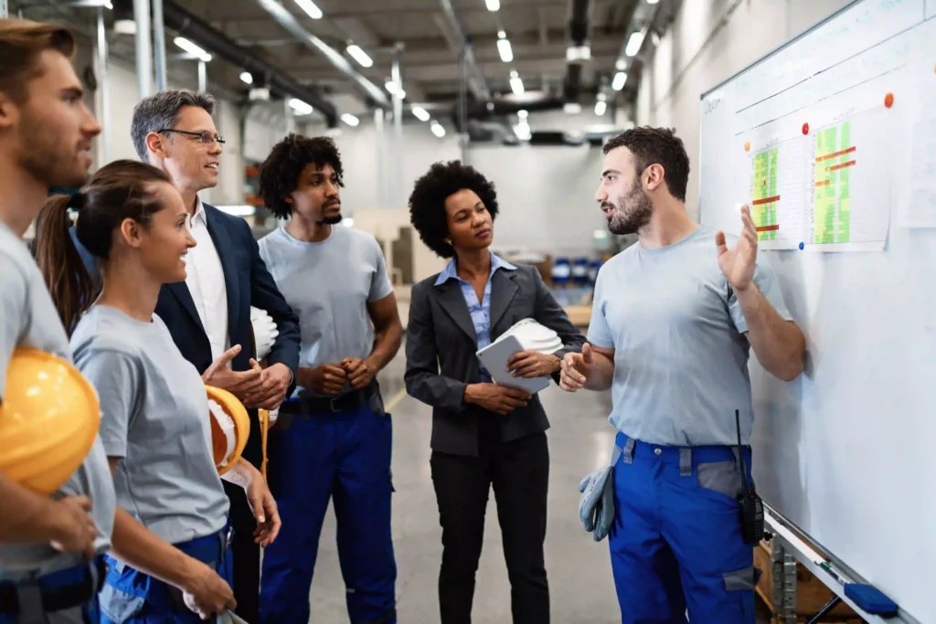 How to Choose an RTLS Vendor: The Industrial Buyer's Guide (2026) 22 RTLS vendor demonstration meeting with warehouse safety team reviewing system capabilities