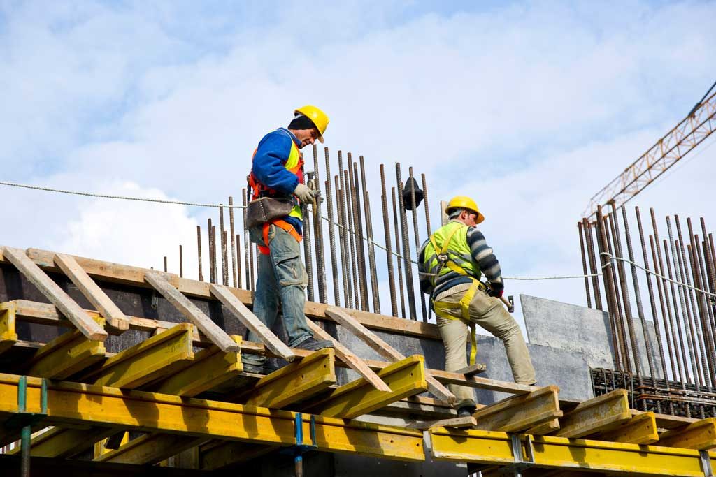 Workers examining work